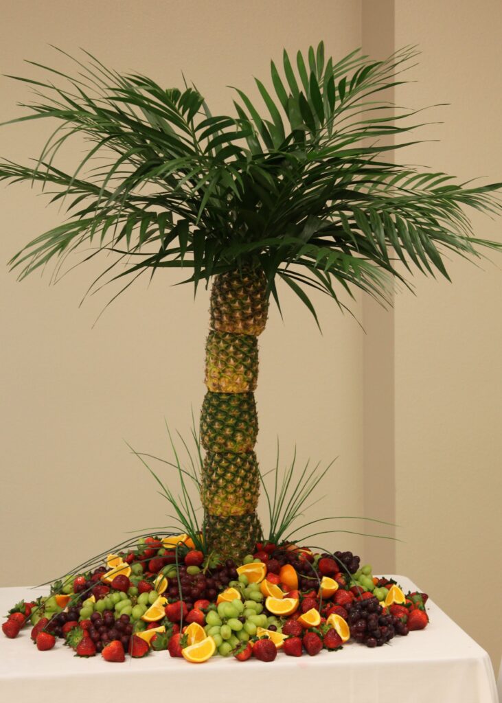 Pineapple palm tree fruit display for a luau party